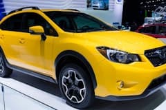 Subaru Crosstrek in Sunrise Yellow on display during an auto show