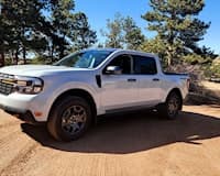 white 2023 ford maverick lariat tremor front side view
