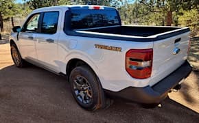 white 2023 ford maverick lariat tremor back view