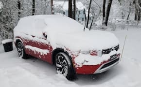 2024 Mitsubishi Outlander PHEV covered in snow