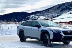 Outback Wilderness parked with a snowy mountain background