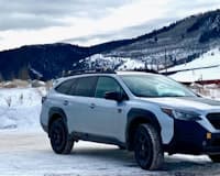 Outback Wilderness parked with a snowy mountain background
