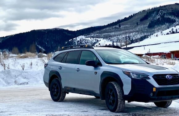 Outback Wilderness parked with a snowy mountain background