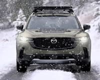 2024 Mazda CX-50 front view with headlights on