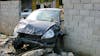 Car crashed through wall