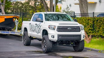 White Toyota Tundra parked in the side street