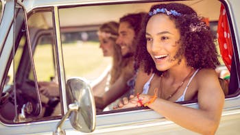 Hipster friends inside a van