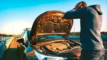 Man with a broken car