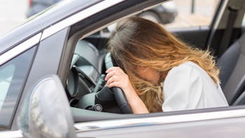 Frustraded lady driver inside the car