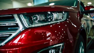 Close up view of row new car design at dealership indoors — Photo by saragolfart@gmail.com