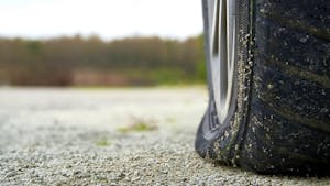 Close-up of Flat rear tire on car