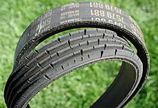 Tiny cracks in a serpentine belt aren't necessarily bad, but the deep ones here mean it's running out of time. Because this belt was removed to replace an alternator, the mechanic replaced it with a new one to save trouble down the road.