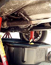 Changing your own oil requires ramps or a jack and jackstands, a box-end wrench and something to catch and contain the oil.